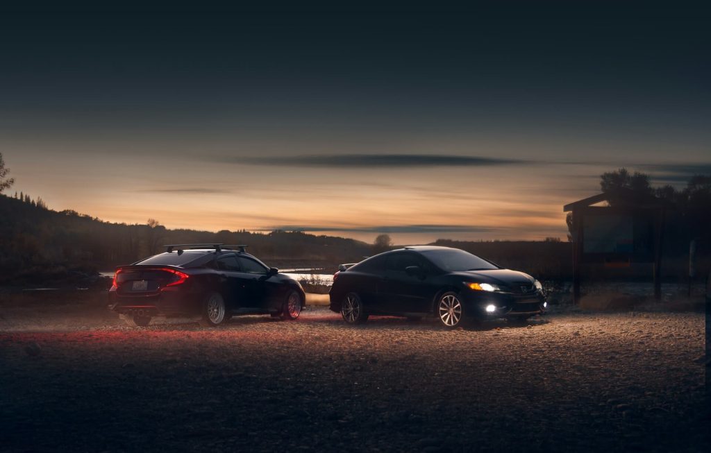 two honda civics at sunset